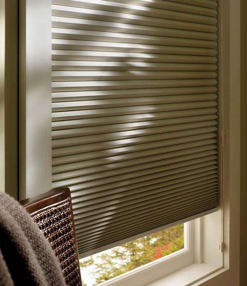 A close up of a window with cellular blinds fitted in it.