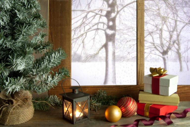 A windowsill with presents, ornaments, and candles